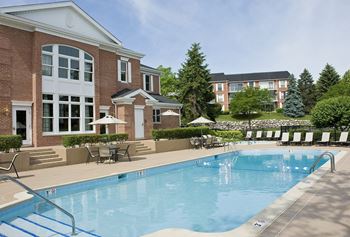 Two relaxing heated swimming pools and spa with sweeping sundeck